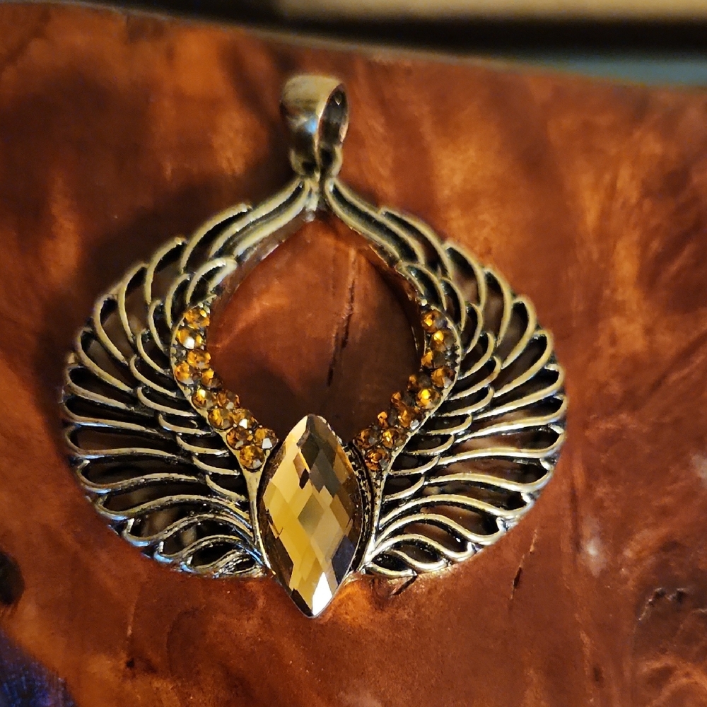 Gold Tone Winged Pendant with Crystal Accents